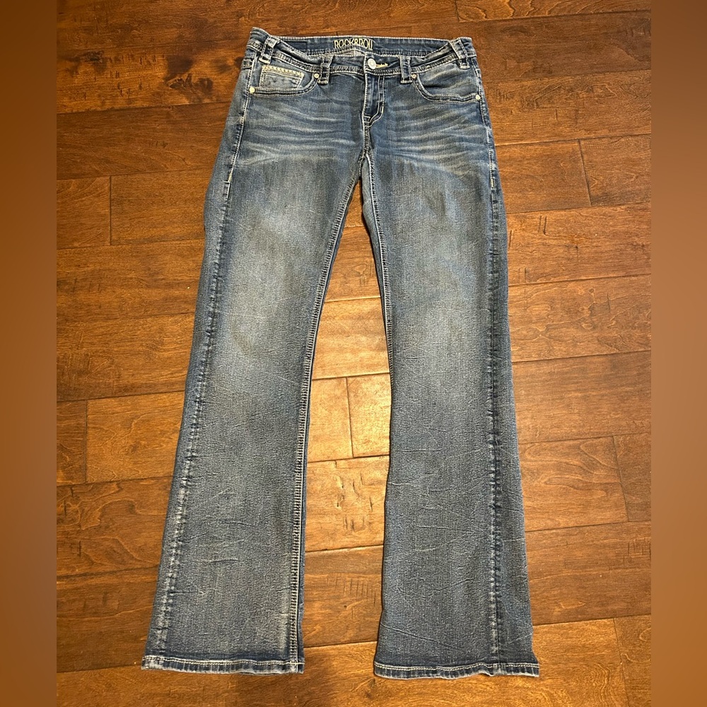 Blue Boot Cut Jeans with Distressed Details